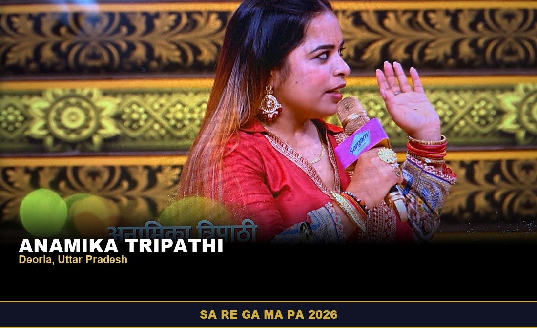 Anamika Tripathi, Sa Re Ga Ma Pa 2026 contestant from Deoria, Uttar Pradesh, singing in a red outfit on the gold-lit stage