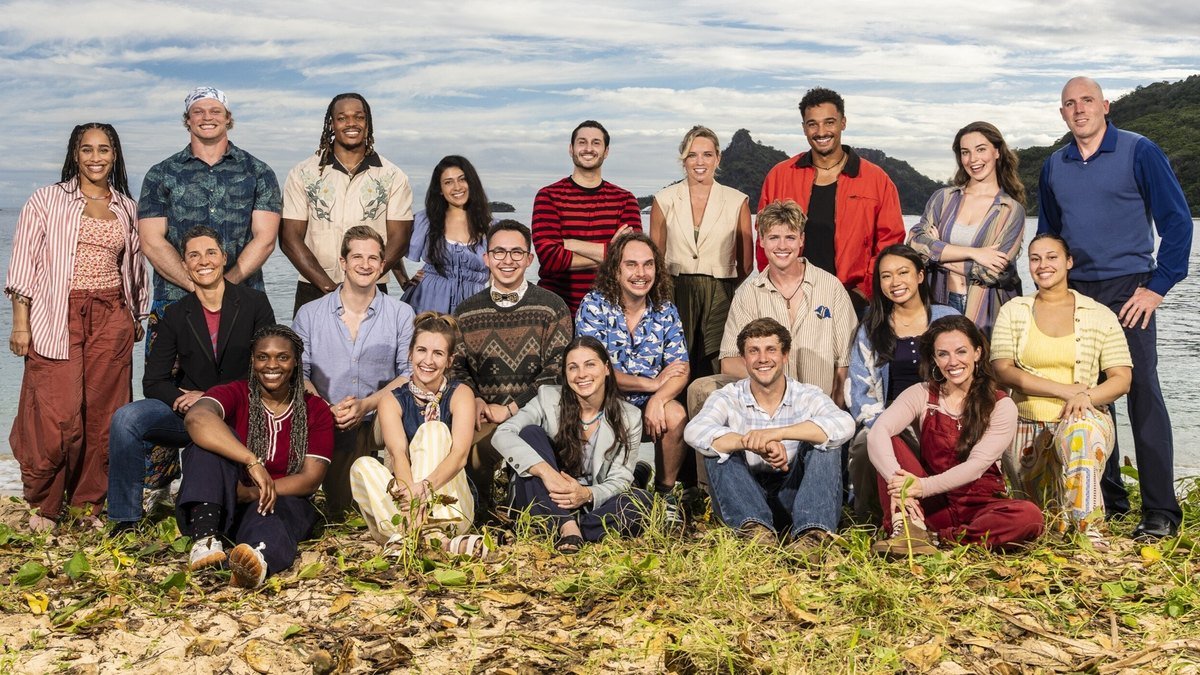 The Survivor 51 contestants posing together on a beach in the Mamanuca Islands, Fiji